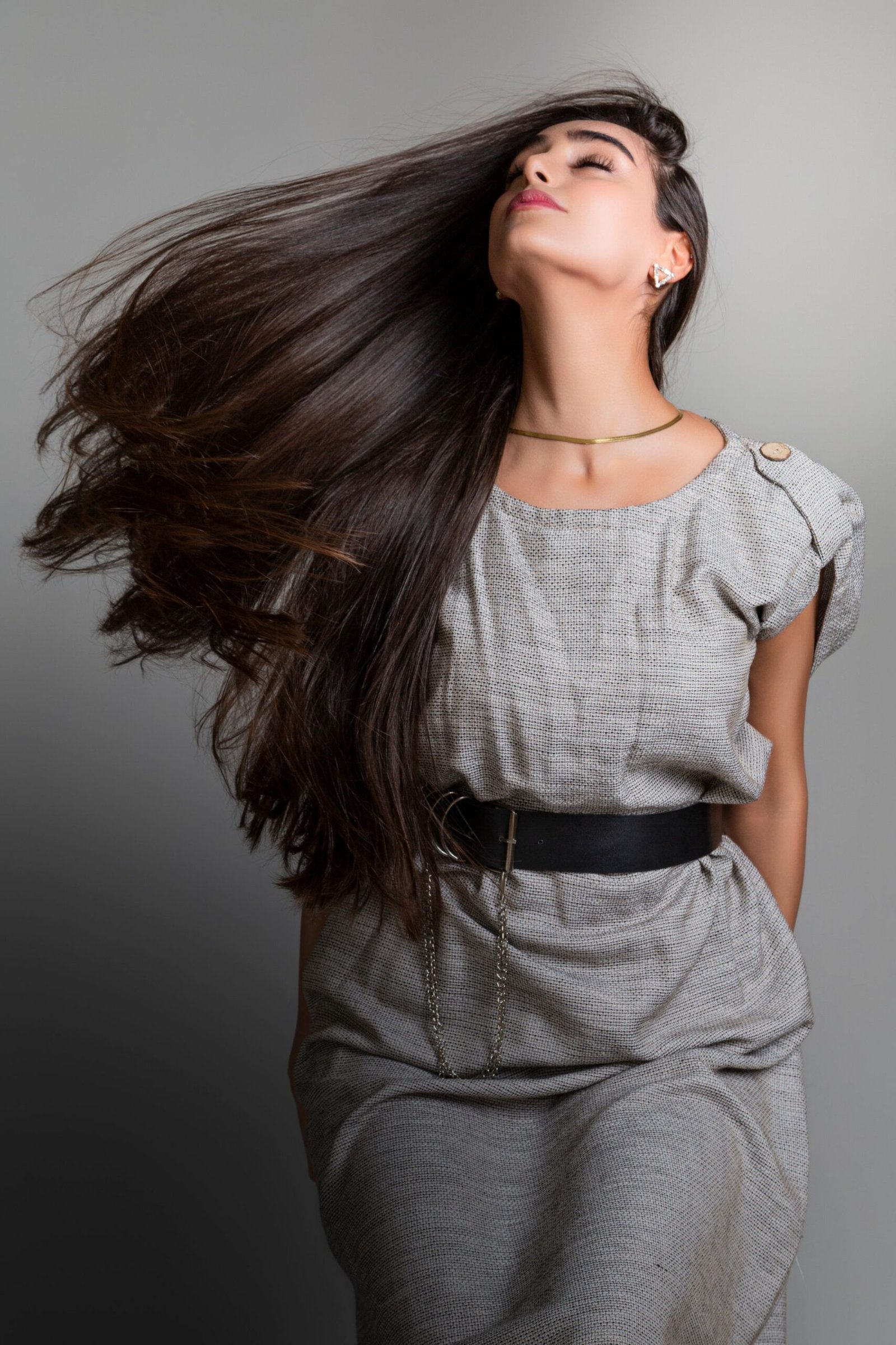 Woman with long, glossy, flowing brunette hair